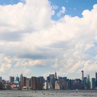 Photographer adjusting studio equipment
